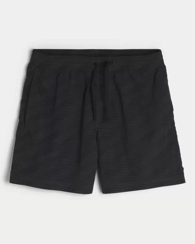 Baggy fotbollsshorts på mitten av låret
