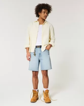 Distressed lösa jeansshorts ovanför knäet