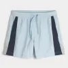 Fotbollsshorts på mitten av låret