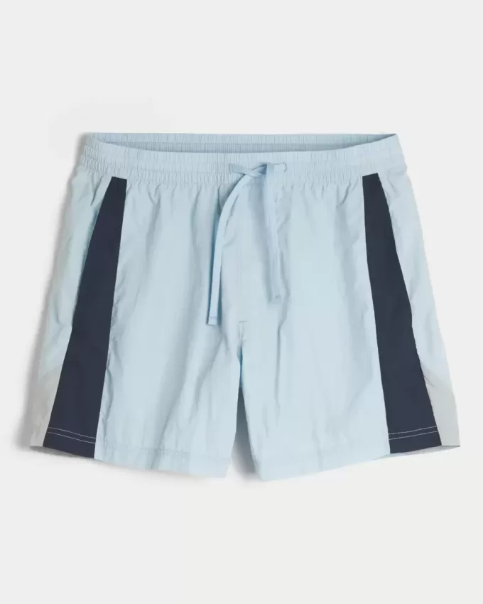 Fotbollsshorts på mitten av låret