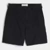 Golfshorts som kyler över knäet