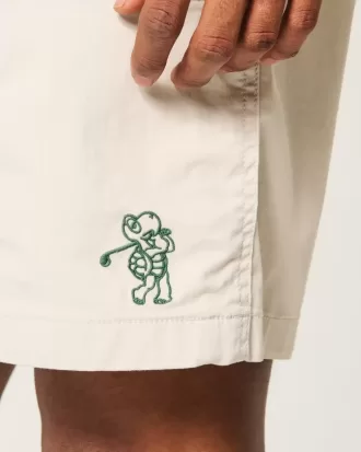 Golfshorts som kyler över knäet