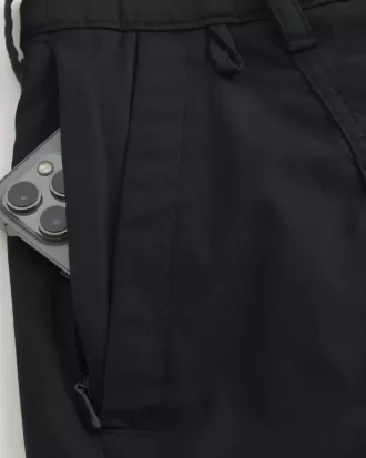 Golfshorts som kyler över knäet