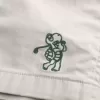 Golfshorts som kyler över knäet