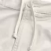 Golfshorts som kyler över knäet