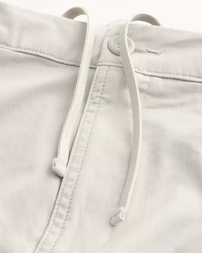 Golfshorts som kyler över knäet