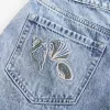 High-Rise Medium Wash Shell broderade baggy jeansshorts 5″ High-Rise Medium Wash Shell broderade baggy jeansshorts 5″