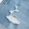 High-Rise Ripped Medium Light Wash Shortieshorts i denim High-Rise Ripped Medium Light Wash Shortieshorts i denim