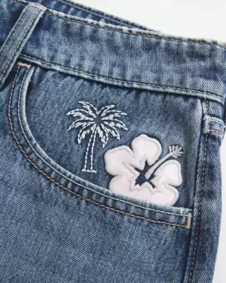 Low-Rise Broderad Denim Mini Skort