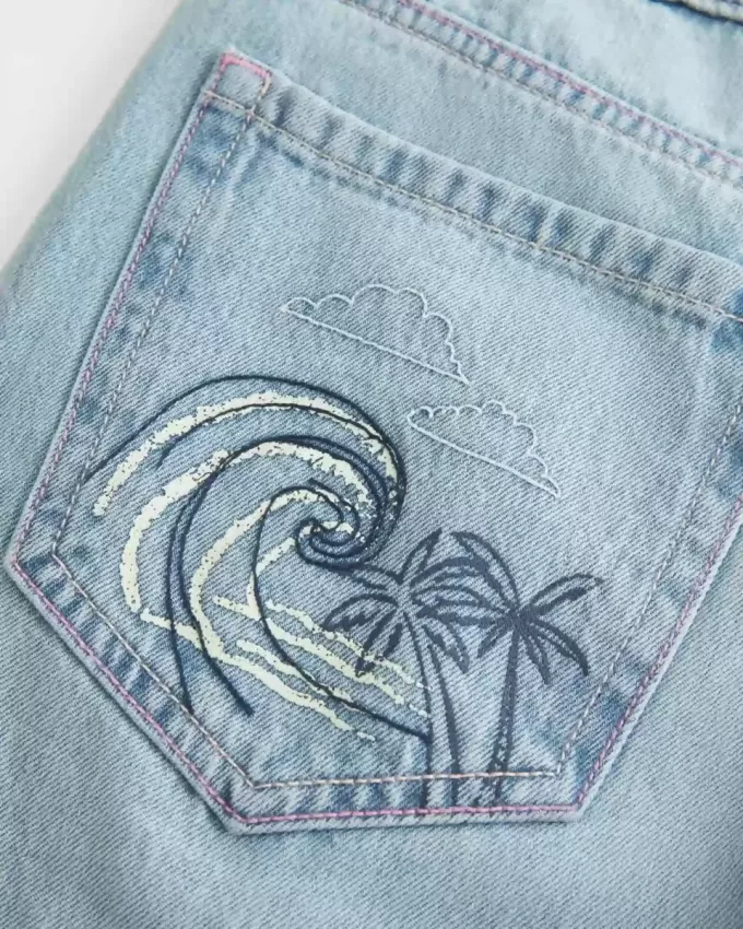 Low-Rise Ripped Light Wash Graphic Baggy Jeans Low-Rise Ripped Light Wash Graphic Baggy Jeans