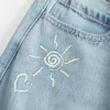 Low-Rise Ripped Light Wash Graphic Baggy Jeans Low-Rise Ripped Light Wash Graphic Baggy Jeans