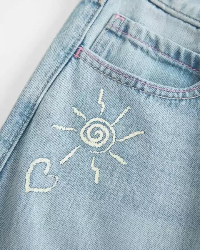 Low-Rise Ripped Light Wash Graphic Baggy Jeans Low-Rise Ripped Light Wash Graphic Baggy Jeans
