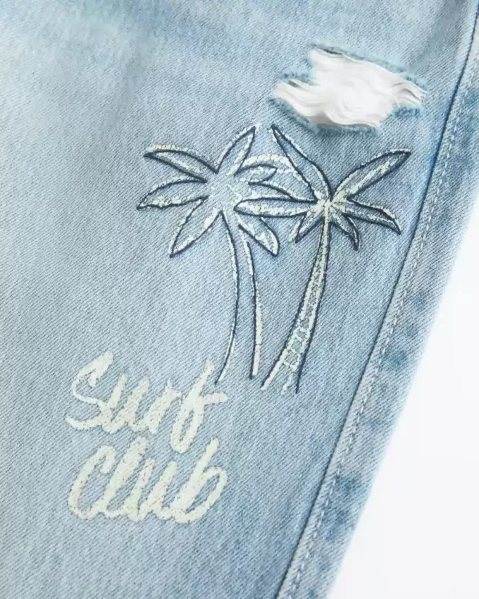 Low-Rise Ripped Light Wash Graphic Baggy Jeans Low-Rise Ripped Light Wash Graphic Baggy Jeans