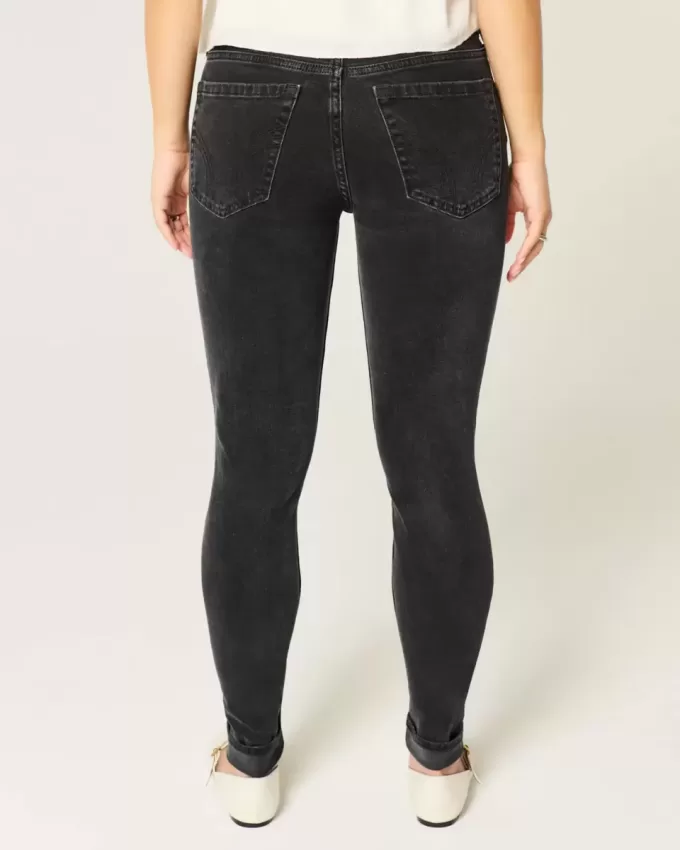 Mid-Rise tvättade svarta skinny jeans