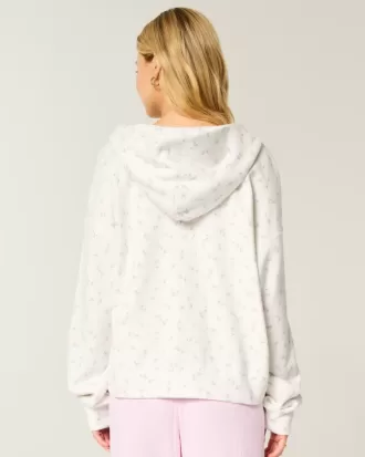 Oversized hoodie med dragkedja i blommönster