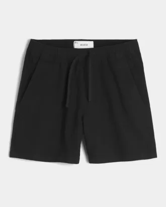 Pådragsshorts i linneblandning på mitten av låret