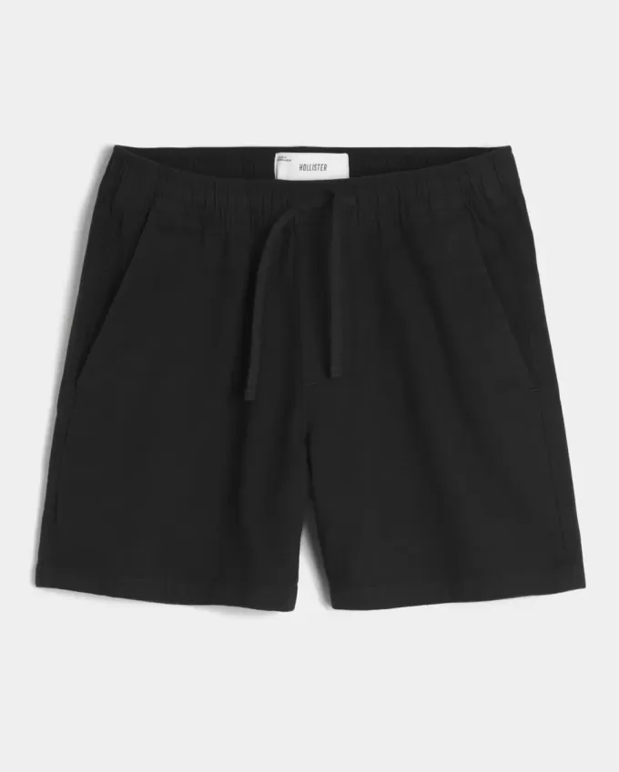 Pådragsshorts i linneblandning på mitten av låret