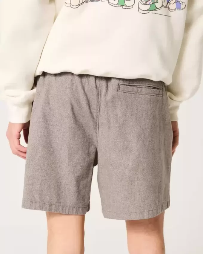 Pådragsshorts i linneblandning på mitten av låret