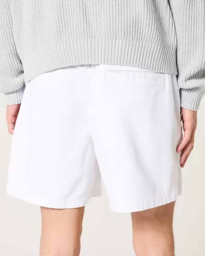 Pådragsshorts i linneblandning på mitten av låret