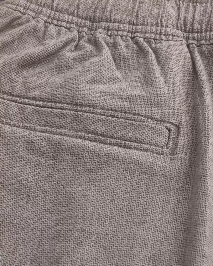 Pådragsshorts i linneblandning på mitten av låret