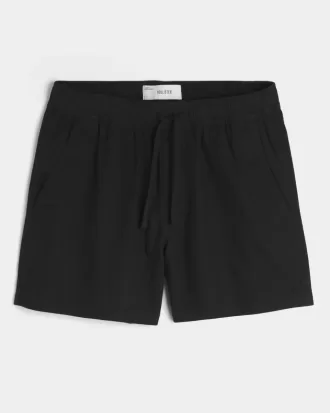 Shorts i linneblandning på mitten av låret