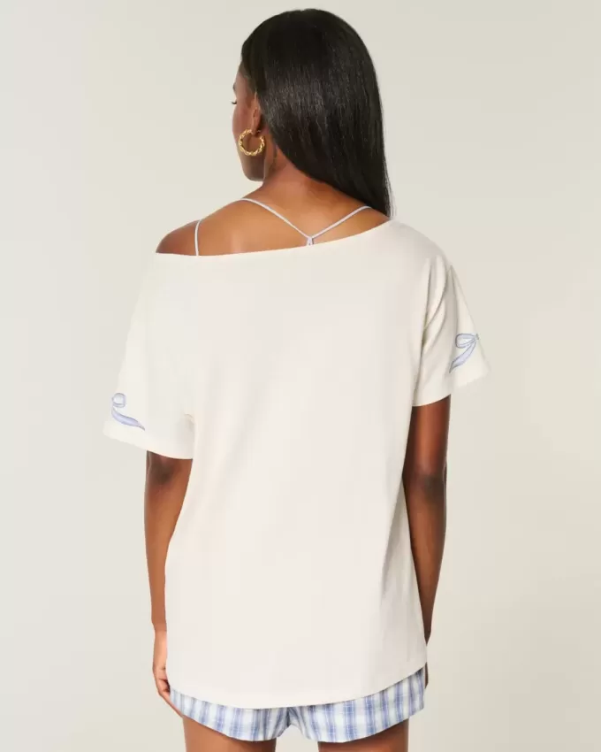 Överdimensionerad off-the-shoulder grafisk t-shirt Överdimensionerad off-the-shoulder grafisk t-shirt